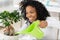 Female florist watering bonsai tree