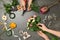 Female florists making beautiful bouquet at table