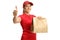 Female food delivery worker holding a bag and gesturing thumb up