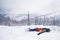 Female freerider with snowboard in the mountains resting