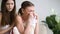Female friend comforting crying upset girl, consoling weeping young lady