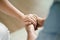 Female friend or family sitting and hold hands during cheer up to mental depress man, Psychologist provides mental aid to patient