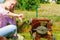 Female gardener with broken lawnmower