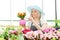 Female gardener examining flower