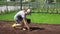 Female gardener hands sowing planting new grass lawn seeds in house yard