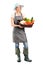 Female gardener holding a basket of vegetables