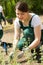 Female gardener placing new plants