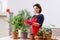 The female gardener with plants indoors