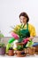 The female gardener with plants indoors