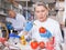 Female geneticist injecting additives into tomatoes