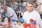 Female geneticist injecting additives into tomatoes