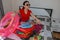 Female Getting Ready For Traveling. young woman, red suitcase, sitting, waiting, summer vacation, colorful, traveling around world
