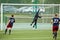 Female goalkeeper returns ball over bar