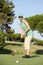 Female Golfer On Golf Course