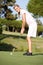 Female Golfer On Golf Course