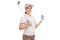 Female golfer holding a golf club and a ball