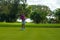 Female golfer practicing at the famous Teeth of the Dog Golf Course of Casa de Campo design by Pete Dye