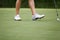 Female golfers walking on green