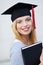 Female graduate holding book