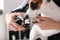 Female groomer cutting dog\'s claws in salon