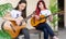 Female guitarists talking during music session