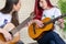 Female guitarists talking during music session