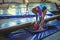 Female gymnast applying chalk powder on her hands before practicing