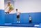 Female gymnast exercising L shape on trampoline