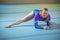 Female gymnast performing stretching exercise in the gymnasium