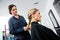 Female Hairdresser Braiding Client\'s Hair