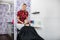 Female Hairdresser Washing Customer\'s Hair In Salon