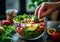 Female hand adding broccoli to summer fresh vegetarian salad with healthy vegetables on kitchen background.Macro.AI Generative