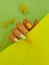 Female hand beautiful elegant  spring  wellness  manicure  on colored background