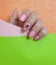 Female hand  beauty  pastel summer creativity lifestyle elegance polish colored background