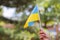 Female hand with a blue and yellow flag Ukraine Independence Day