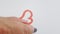 Female hand draws red lipstick heart and arrow, love symbols, Valentine`s day, video, cute drawing, 4K