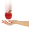 Female hand with fresh red apple