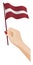 Female hand gently holds small flag of Latvia. Holiday design element. Cartoon vector on white background