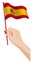 Female hand gently holds small Spain flag. Holiday design element. Cartoon vector on white background