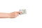 Female hand giving a bundle of dollar bills on white isolated background. Power and wealth concept