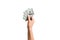 Female hand giving a bundle of dollar bills on white isolated background. Top view of power and wealth concept