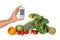 Female hand with glucometer and healthy food on white background. Diabetes diet