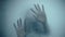 Female hand and head, spooky shadows on the glass wall, in full HD, Horror movie scene