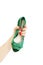 Female hand holding green sandals