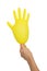 Female hand holding an inflated yellow glove