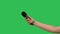 Female hand holding microphone against background green screen chroma key. Close up mic, interview, live press