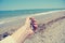 Female hand holding pebbles on the beach, retro/vintage