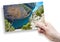 A female hand holding an postcard about the largest European canyon called Verdon Gorges Europe-France-Provence - concept image