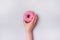 Female Hand Holding Sweet Donut with Sprinkles Blue Background Tasty Donut Top View