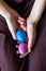 Female hand holding two colored easter eggs.